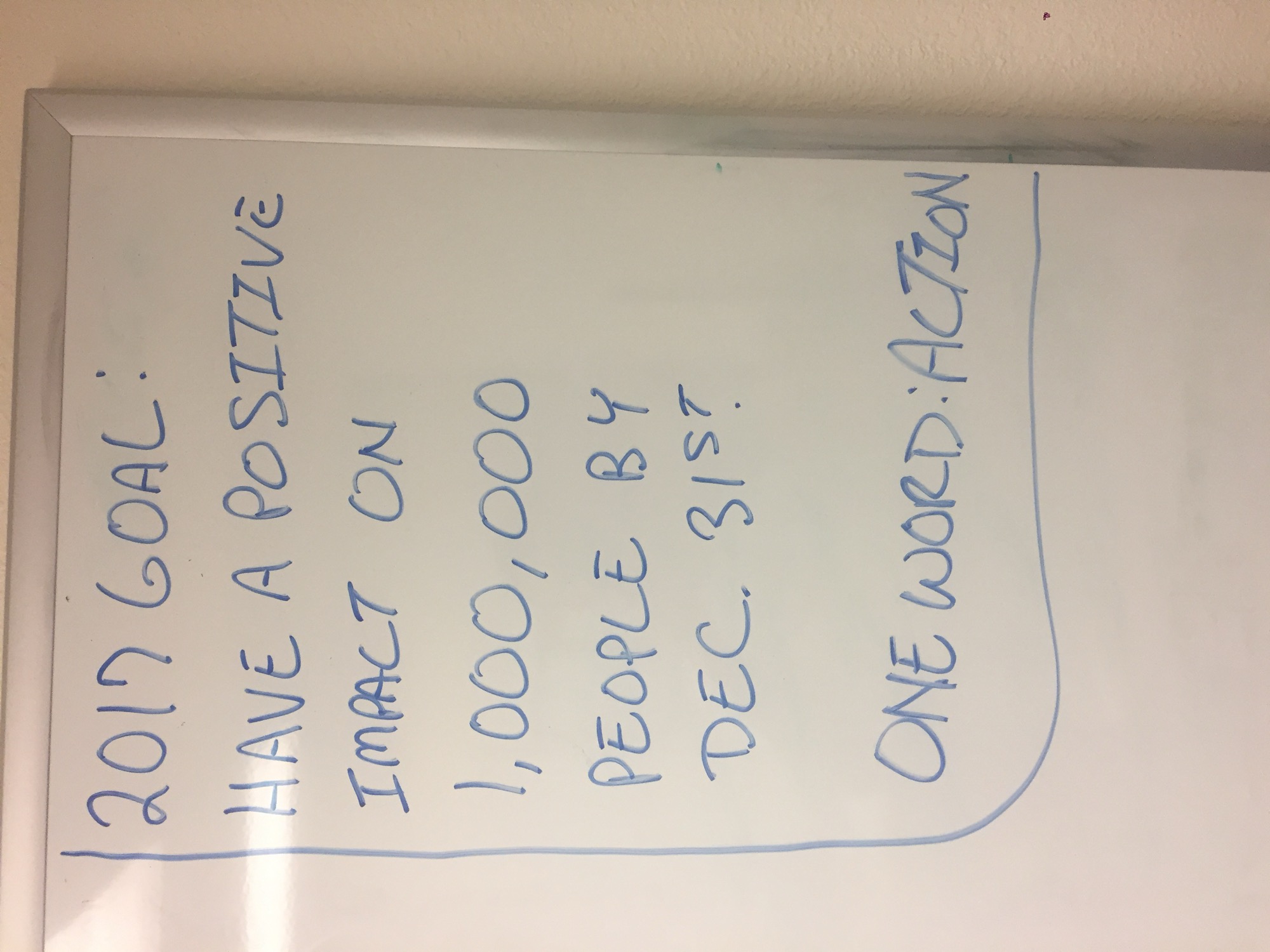 The 2017 whiteboard: have a positive impact on 1,000,000 people. One word: action.